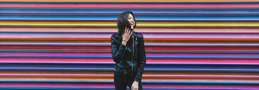     | Woman standing in front of the rainbow wall 